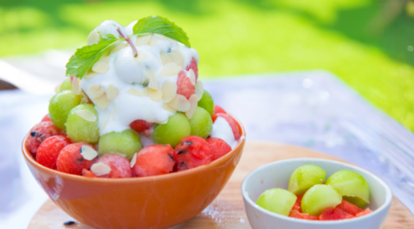 Fresh fruit bowl with watermelon, berries and seasonal summer fruit.